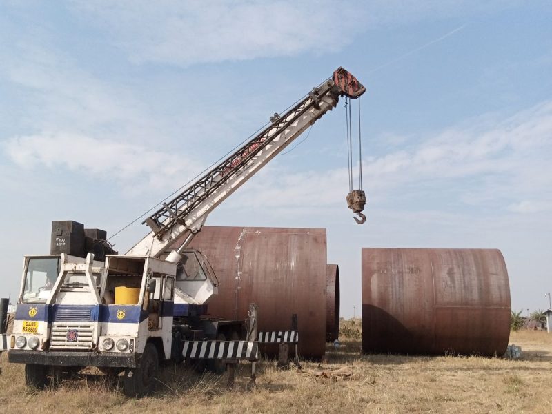 Mobile crane lifting large steel sections